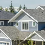 house with blue siding and grey roof